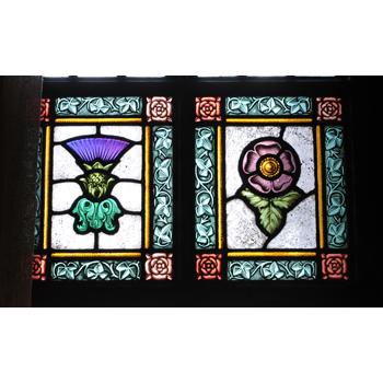 The Saal contains beautiful stained glass windows mostly featuring alpine flowers like the thistle and rose.